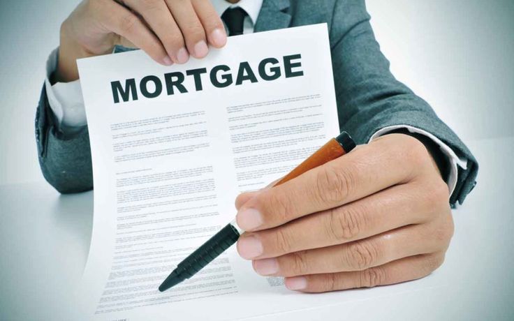 House key representing home buying and mortgage approval