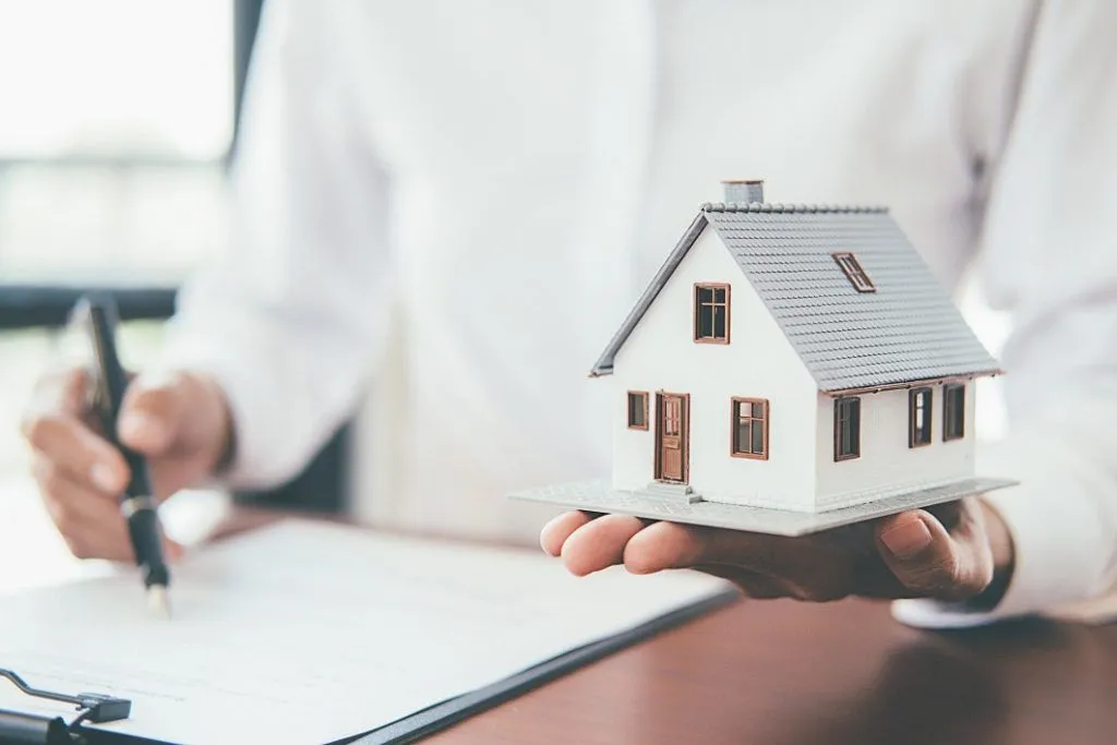Real estate agent discussing mortgage options with a home buyer
